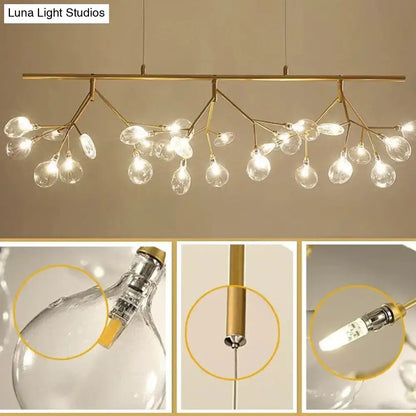Gold-toned branch-style pendant light fixture with clear glass globe bulbs for modern black branching chandelier dining room