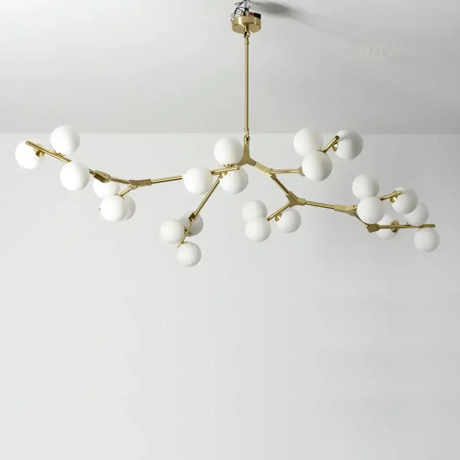 Modern gold-toned branch-style pendant lights with white glass balls led globes for stylish living room decorbites glass balls