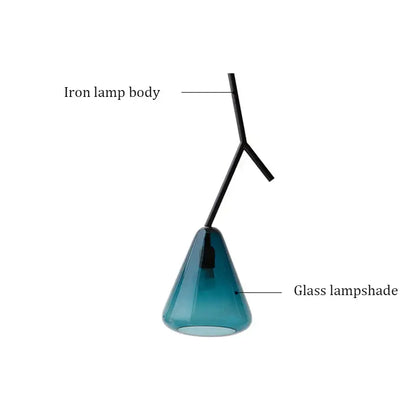 A modern black branching glass pendant light with matte iron frame and translucent teal glass shade for dining rooms