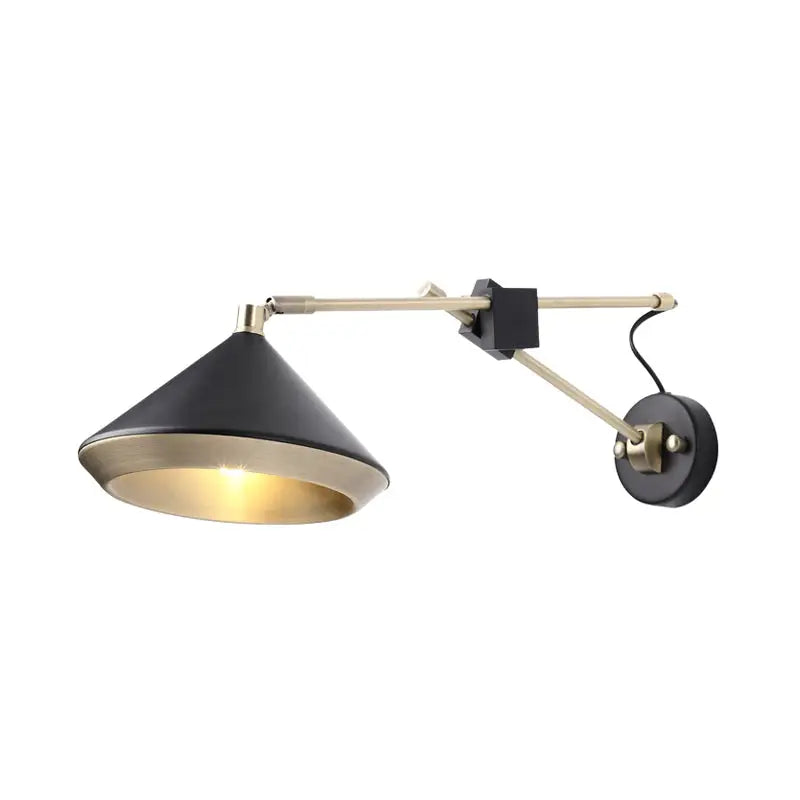 Modern black and brass wall light with adjustable arm and conical shade featuring a bulb base for bedroom use