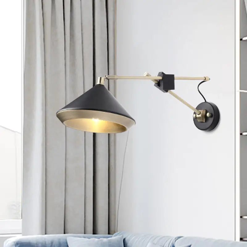 Modern black and brass adjustable arm wall light with conical shade and bulb base for bedroom sconce lighting