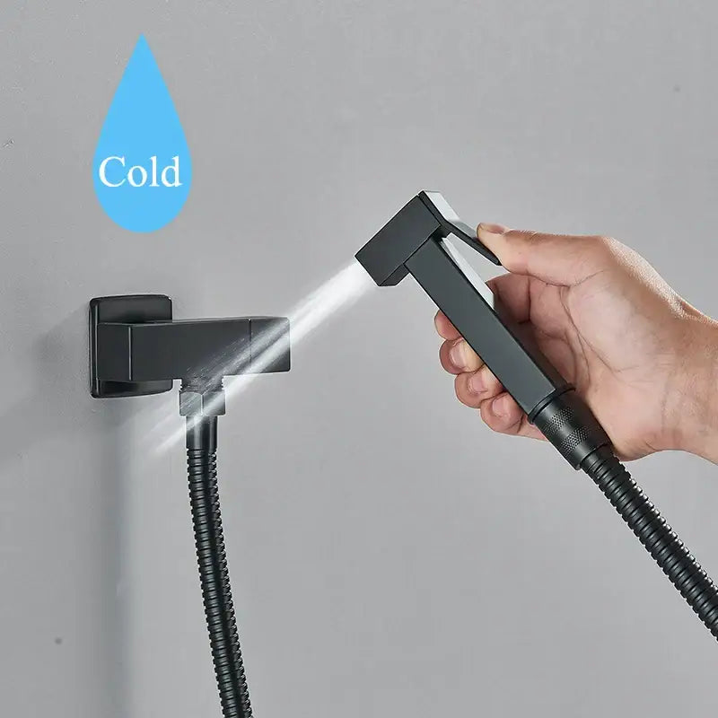 Modern black brass bidet faucet handheld sprayer gun with black matte finish flexible hose and wall-mounted base decorbites black brass