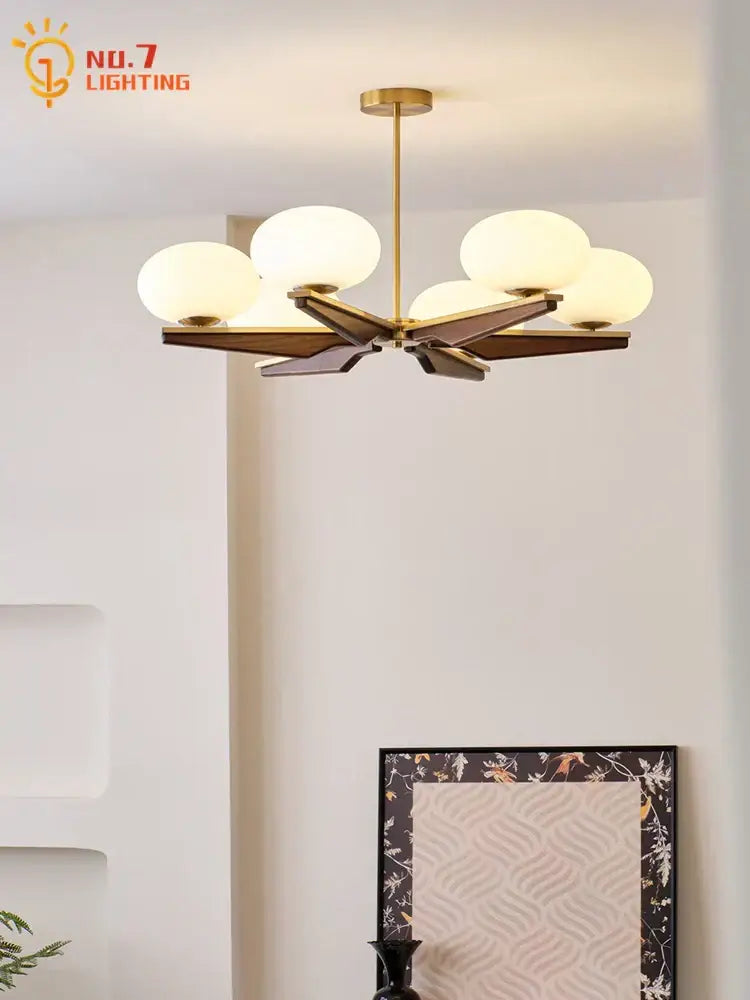 Modern black and brass wood led chandelier with cream wood geometric base and five frosted glass globe shades decorbites cream wood
