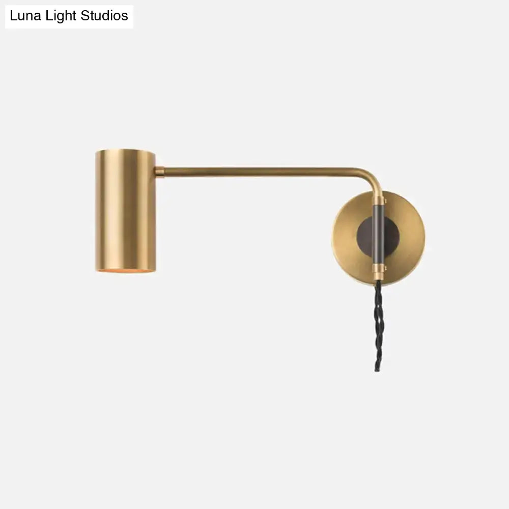 Modern black and brass curved arm wall lamp with cylindrical shade and black twisted cord for bedroom lighting fixture height