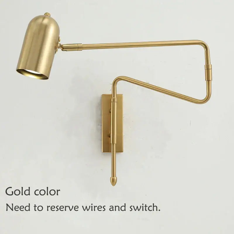 Gold-colored brass wall lamp with articulated arms and cylindrical shade decorbites adjustable long-arm for bedroom use