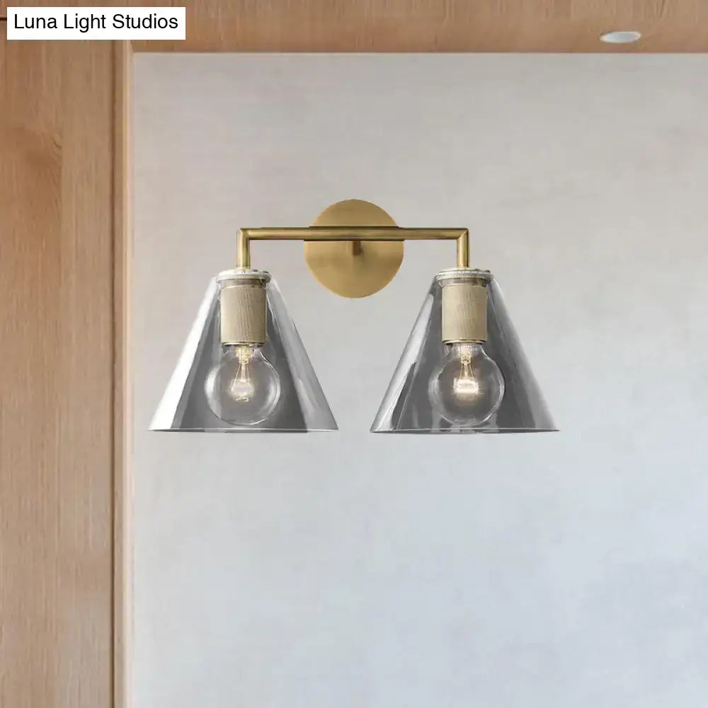 Modern black and brass wall light with two silver glass cone shades and exposed bulbs direct wired electric design