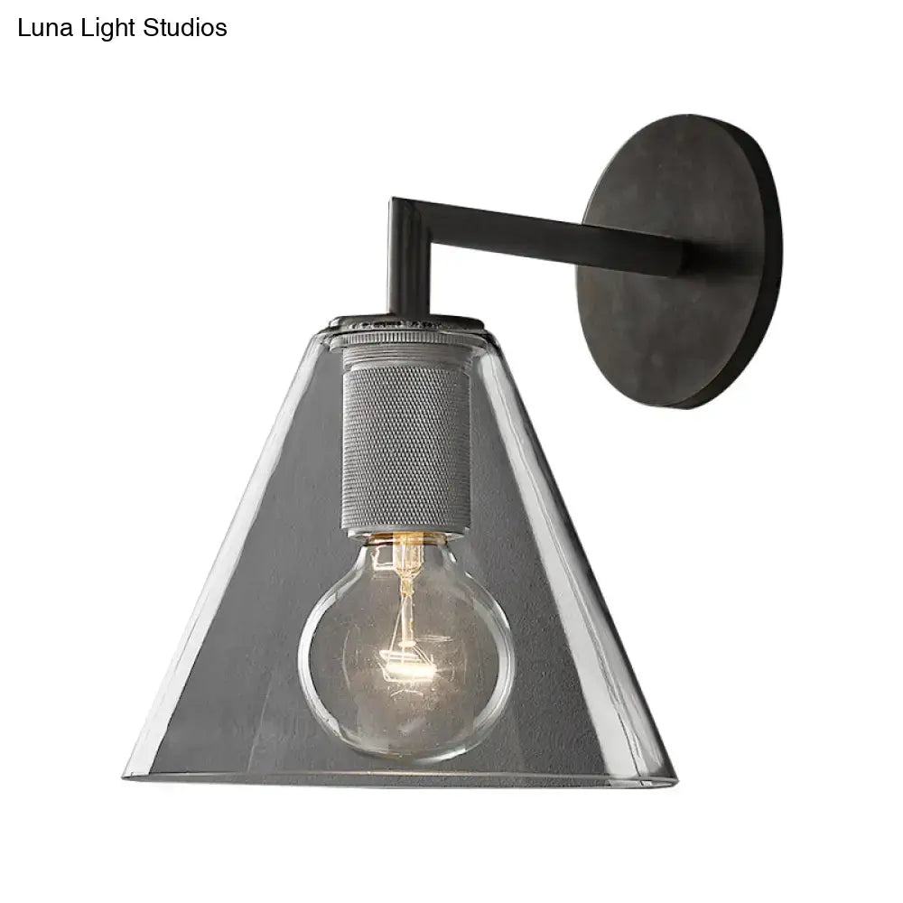 Modern black and brass glass cone wall light with matte black metal arm and clear shade direct wired electric fixture