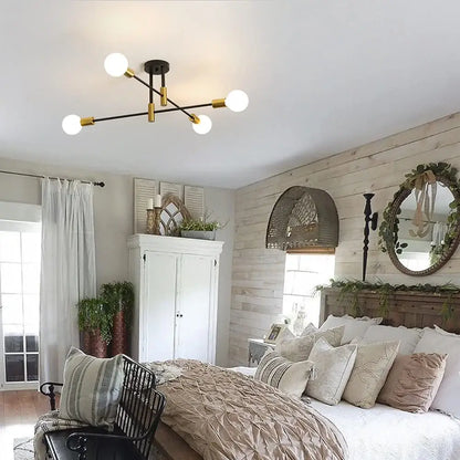 Modern black and brass industrial sputnik chandelier ceiling light with four spherical white bulbs for kitchen decorbites