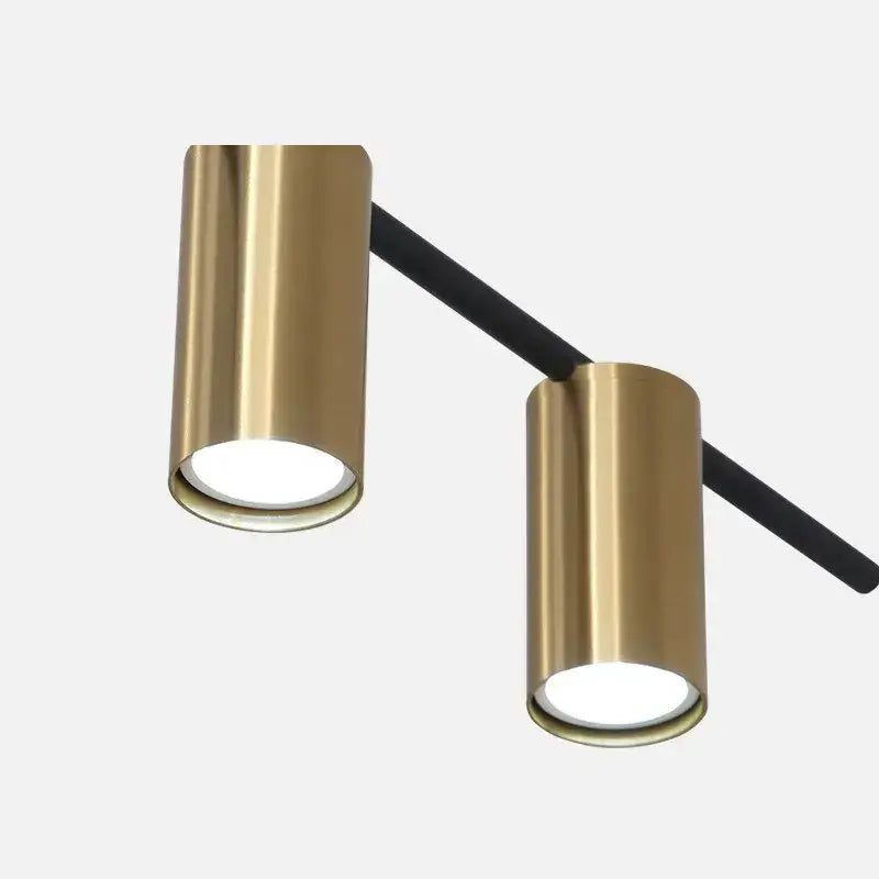 Modern black and brass minimalist dining room linear pendant light with gold-finished cylindrical led track lights and black arms for decorbites black minimalist dining