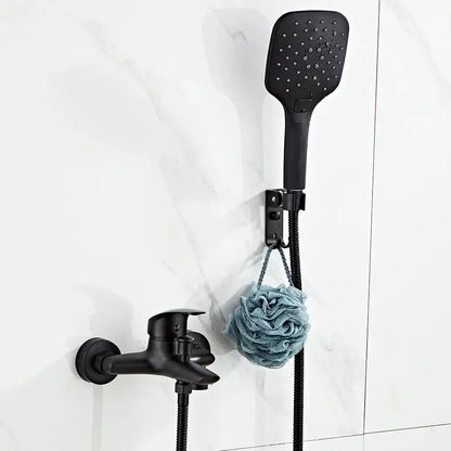 Modern black brass shower faucet set with a black matte square shower faucet and matching wall bracket above faucet set