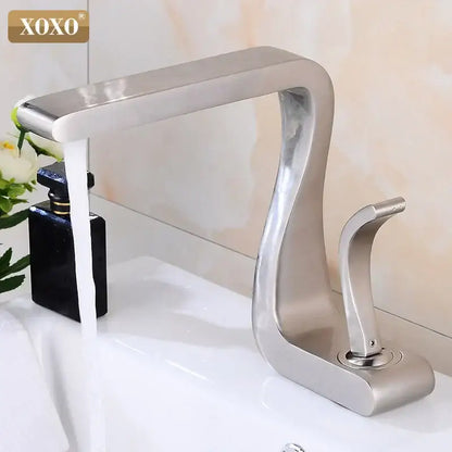 Modern black brass basin faucet with single handle and brushed stainless steel waterfall design for bathroom sink decorbites