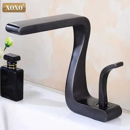 Modern black brass basin faucet with single handle and sleek curved matte finish for bathroom sink decorbites design