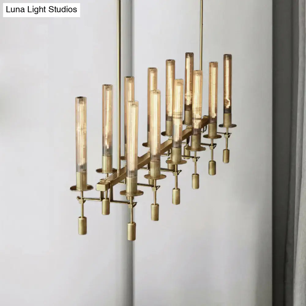 Brass-toned tube island chandelier with multiple cylindrical glass bulbs in a modern black brass linear design