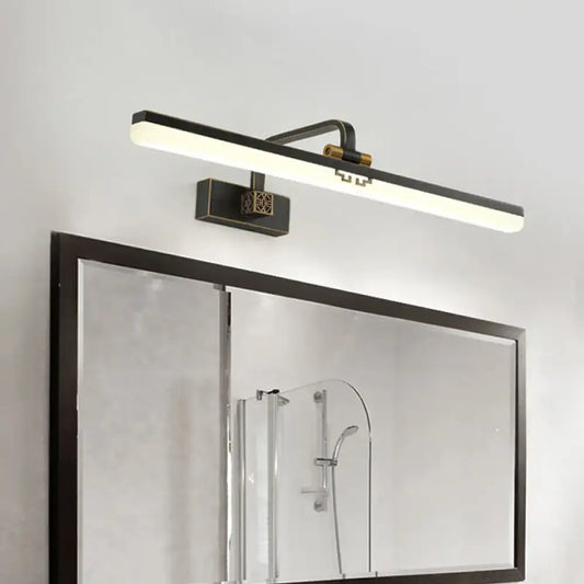 Modern black and brass wall vanity light with a sleek rectangular design for light metallic mirror bathroom cabinets