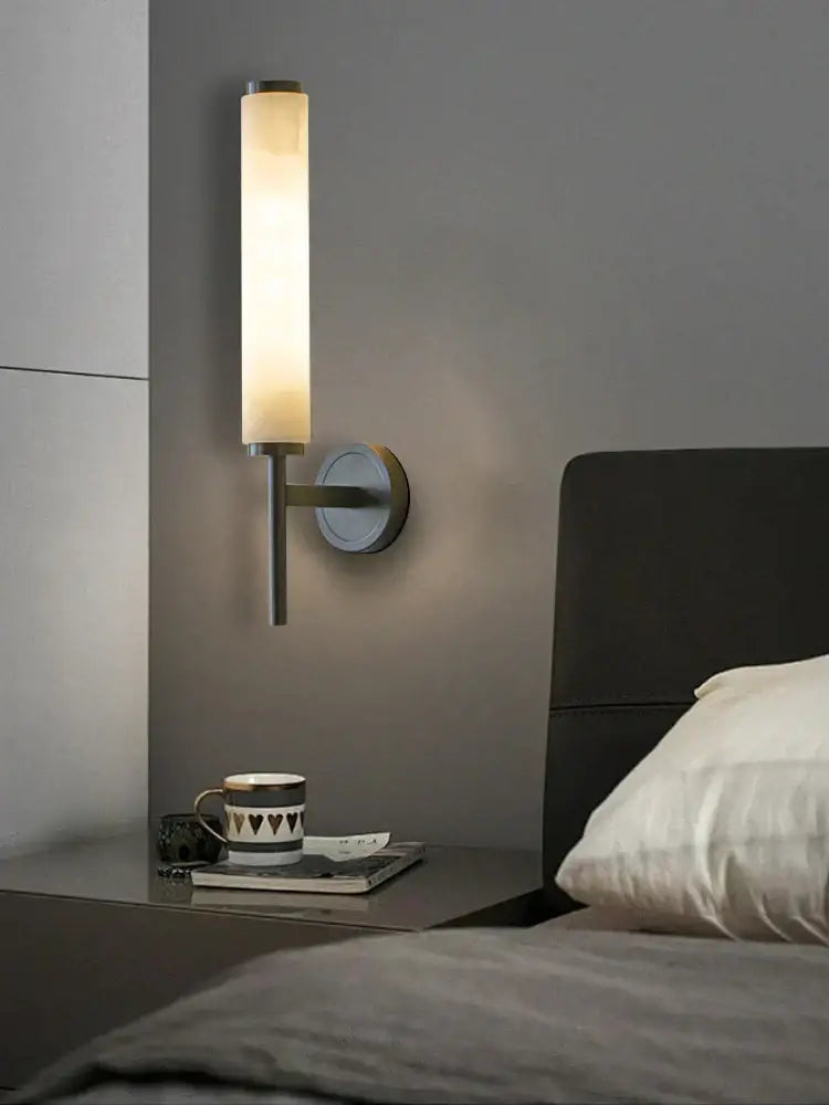 Modern minimalist living room wall light with cylindrical frosted glass shade and decorbites black bronze brass base