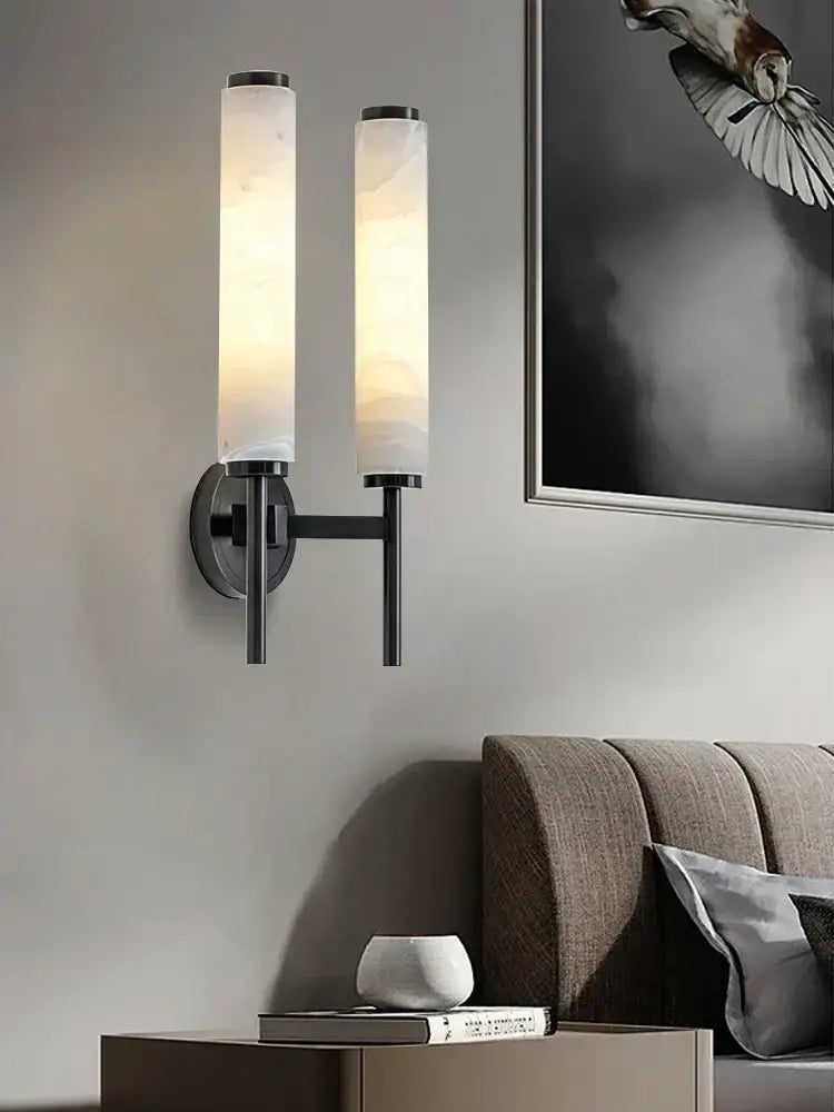 Modern black bronze brass wall lights with two frosted alabaster shades emitting warm glow for living room decorbites