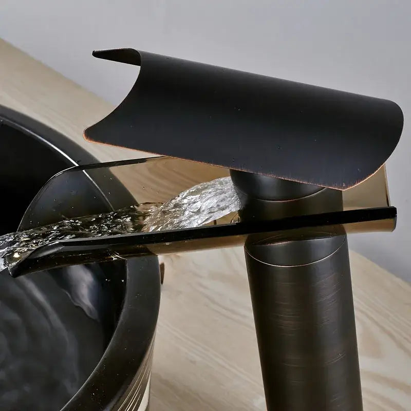 Modern black bronze glass waterfall tap with black matte finish and copper-toned decorbites black bronze accents