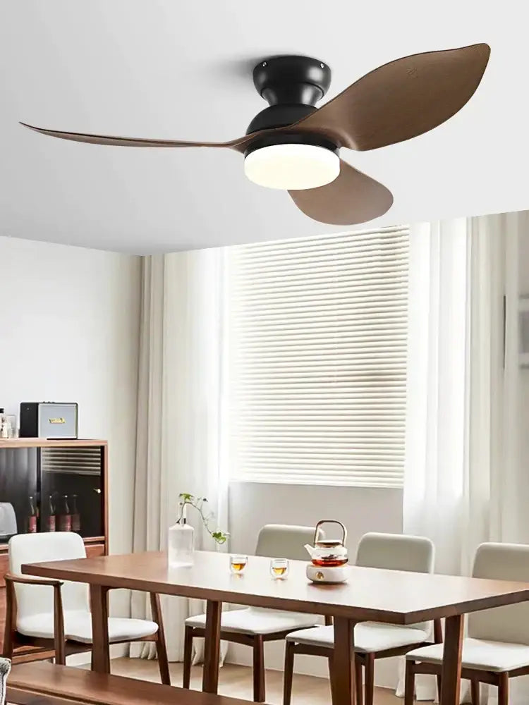 Modern black low floor ceiling fan with three matte black and brown wooden blades and integrated led light fixture
