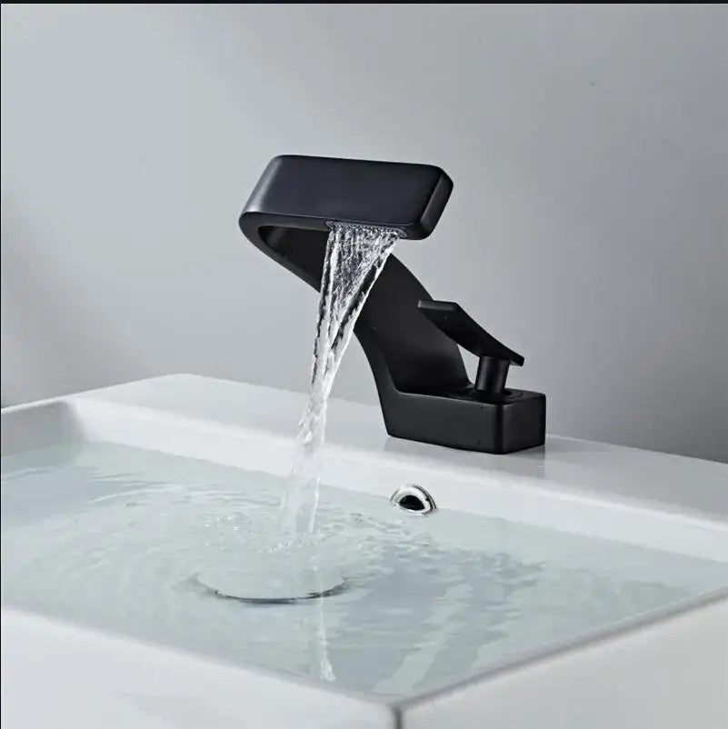 Modern black matte finish decorbites basin faucet with brushed gold accents and sleek waterfall design for bathroom use