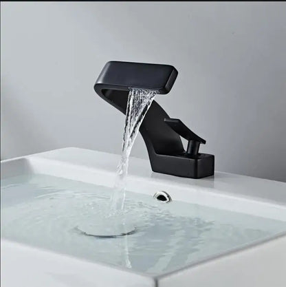 Modern black matte finish decorbites basin faucet with brushed gold accents and sleek waterfall design for bathroom use