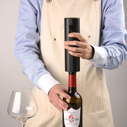 Modern black brushed metal electric wine opener with cylindrical design for effortless wine opening