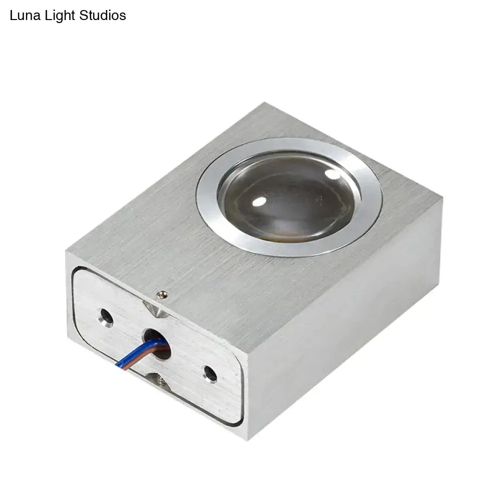 Silver rectangular led lighting piece with circular lens and visible wiring in brushed silver rgb wall fixture for corridor