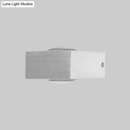 Modern brushed silver rgb wall lighting piece with rectangular design and circular light diffuser for corridor use