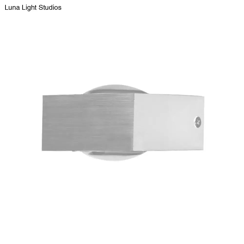 Modern brushed silver rgb wall lighting piece with sleek rectangular design and circular base for corridor use