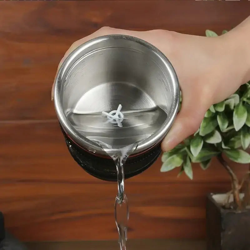 Silver stainless steel blender jar with white plastic blade inside for decorbites camera lens cup self stirring mug