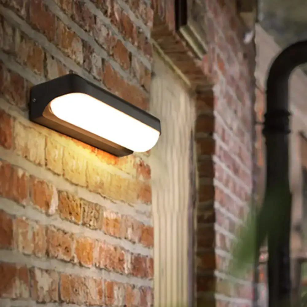 Modern black capsule flush wall sconce wall-mounted lamp with warm white illuminated panel for bedroom lighting