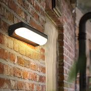 Modern black capsule flush wall sconce wall-mounted lamp with warm white illuminated panel for bedroom lighting