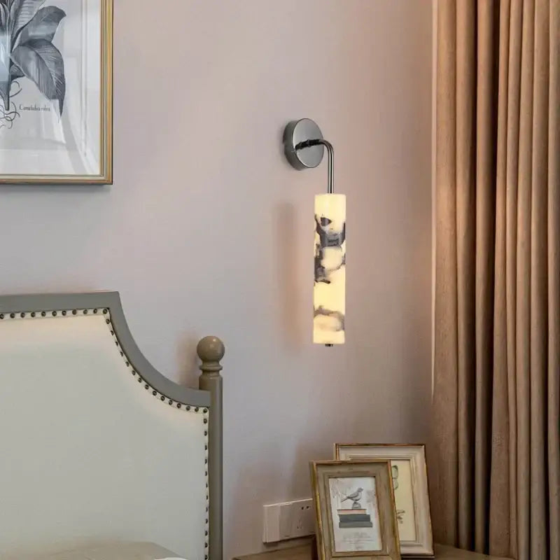 Modern black carbon steel led wall lamp with alabaster bedroom shade featuring a cylindrical frosted marbled glass decorbites carbon steel