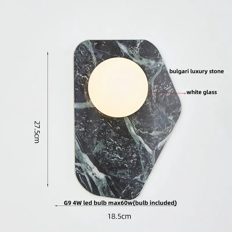 Modern black carbon steel led wall lamp with alabaster shade and circular white glass bulb on bulgari stone plaque