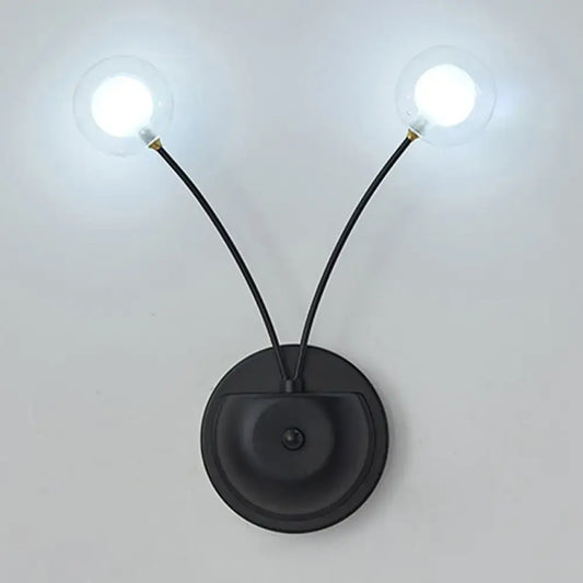 Modern black cast iron double globe wall sconce with two curved arms and clear bulbs for living room lighting fixture inches