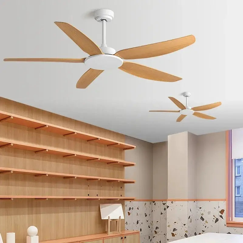 Modern black ceiling fan with remote control featuring five light wood blades and white central housing for living room