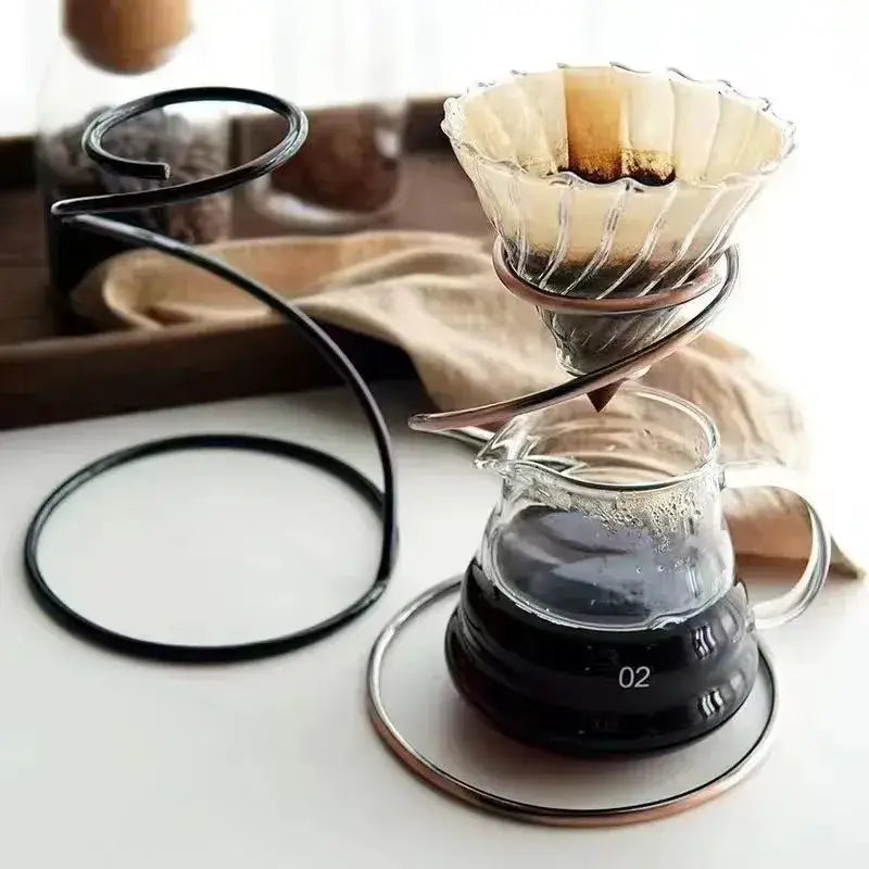 Modern black ceramic coffee barista set with clear glass pour-over dripper featuring a copper metal ring stand decorbites coffee