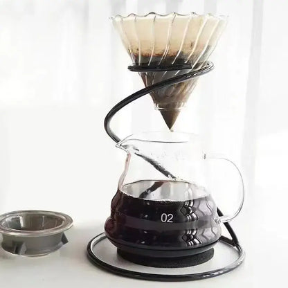 Clear glass pour-over coffee dripper with black ceramic decorbites coffee barista set and spiral metal stand