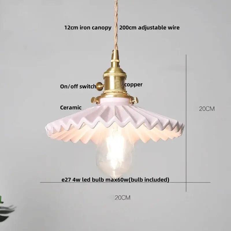 Modern black ceramic led pendant light with brass detail featuring a delicate pink ceramic pendant light and adjustable wire
