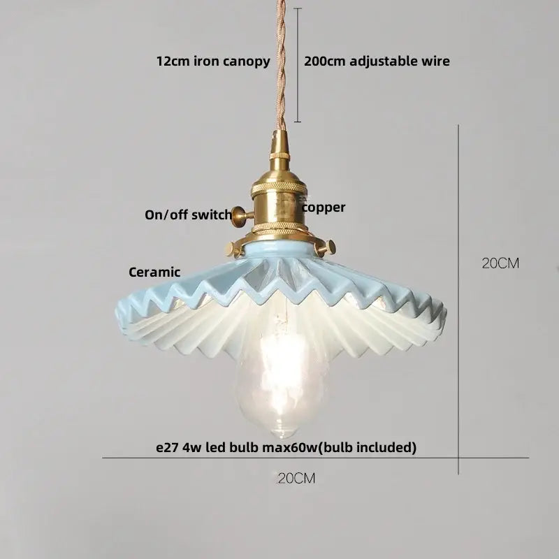 Modern black ceramic led pendant light with brass detail featuring a light blue ceramic lamp and adjustable wire suspension