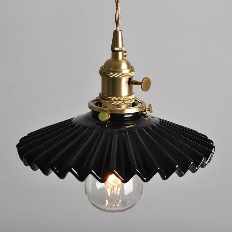 Modern black ceramic led pendant light with brass detail featuring exposed filament bulb for stylish kitchen decorbites pendant light