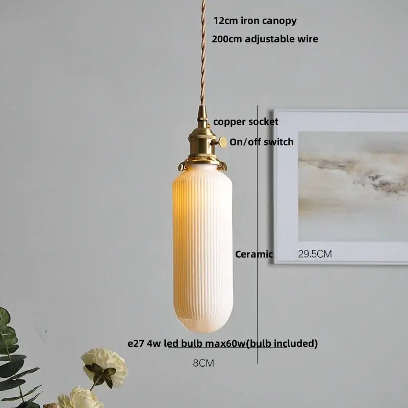 Modern black ceramic led pendant light with warm cream ceramic shade vertical ridges and brass copper socket decorbites black ceramic