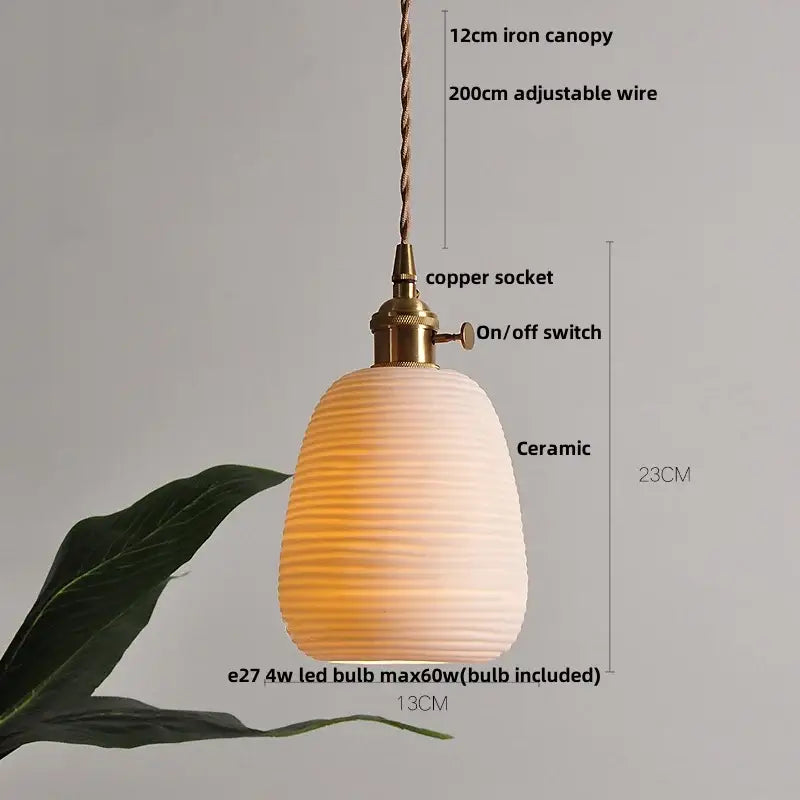 Modern black ceramic led pendant light with honeycomb design and brass detail featuring decorbites black ceramic finish