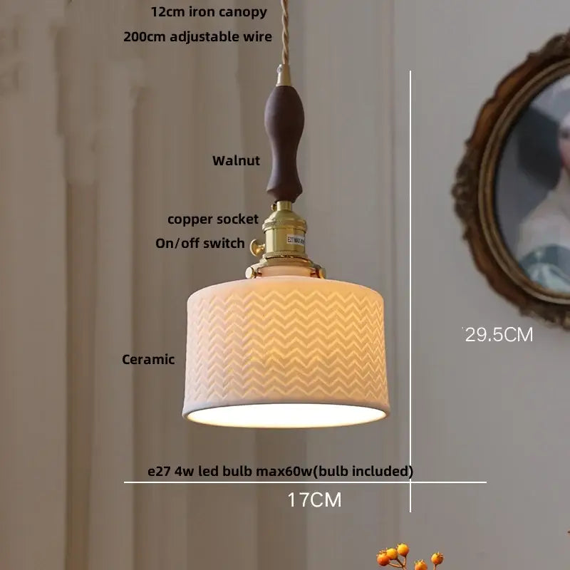 Modern black ceramic led pendant light with warm-toned chevron shade, walnut canopy, and brass decorbites black ceramic detail