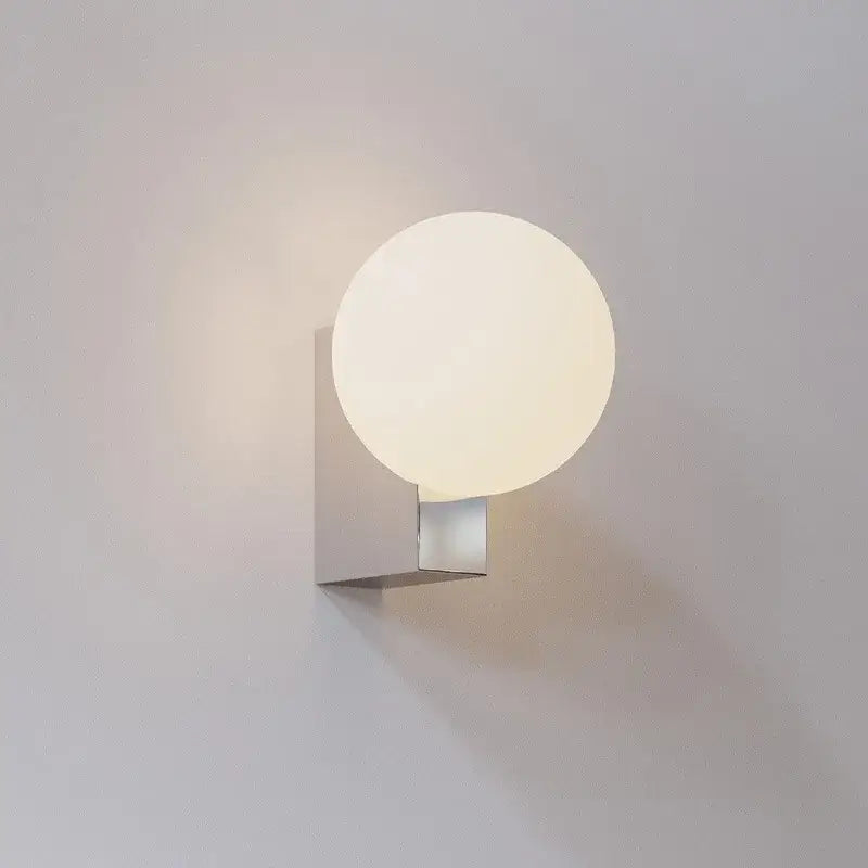 Modern black and chrome decorbites glass ball wall sconce with frosted glass shade on brushed metal base for bedroom light