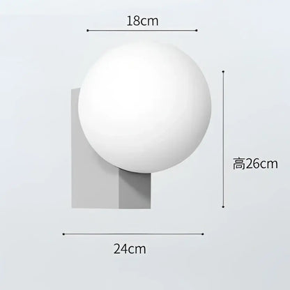 Modern black and chrome decorbites glass ball wall sconce with white matte spherical lamp for bedroom lighting