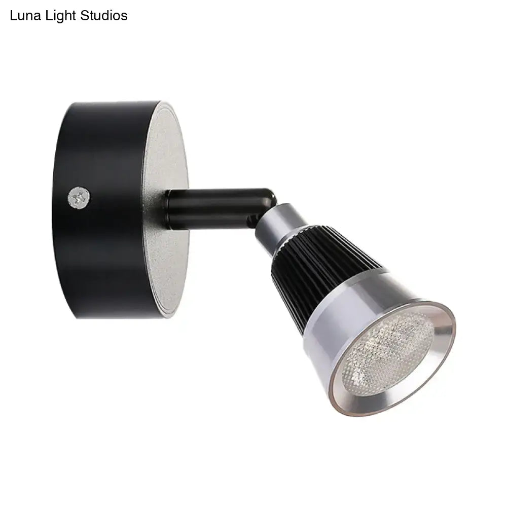 Modern black and chrome smd wall light with adjustable led spotlight and ribbed heat sink for bedroom use