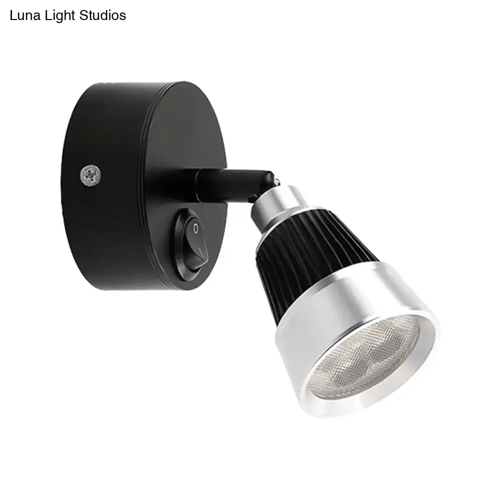 Black and silver adjustable wall light with chrome finish and ribbed heat sink featuring smd light for bedroom use