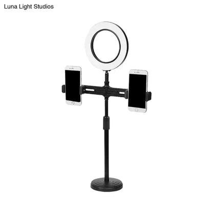 Modern black circle led wall light with usb port features an adjustable black stand, ring light, and two phone holders