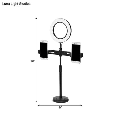 Black adjustable stand with 18 inch circular ring light, two phone holders, and usb port wall light fixture for bedroom