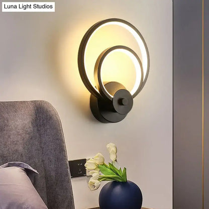 Modern black circular led light fixture with two concentric glowing rings bedroom wall sconce with remote control
